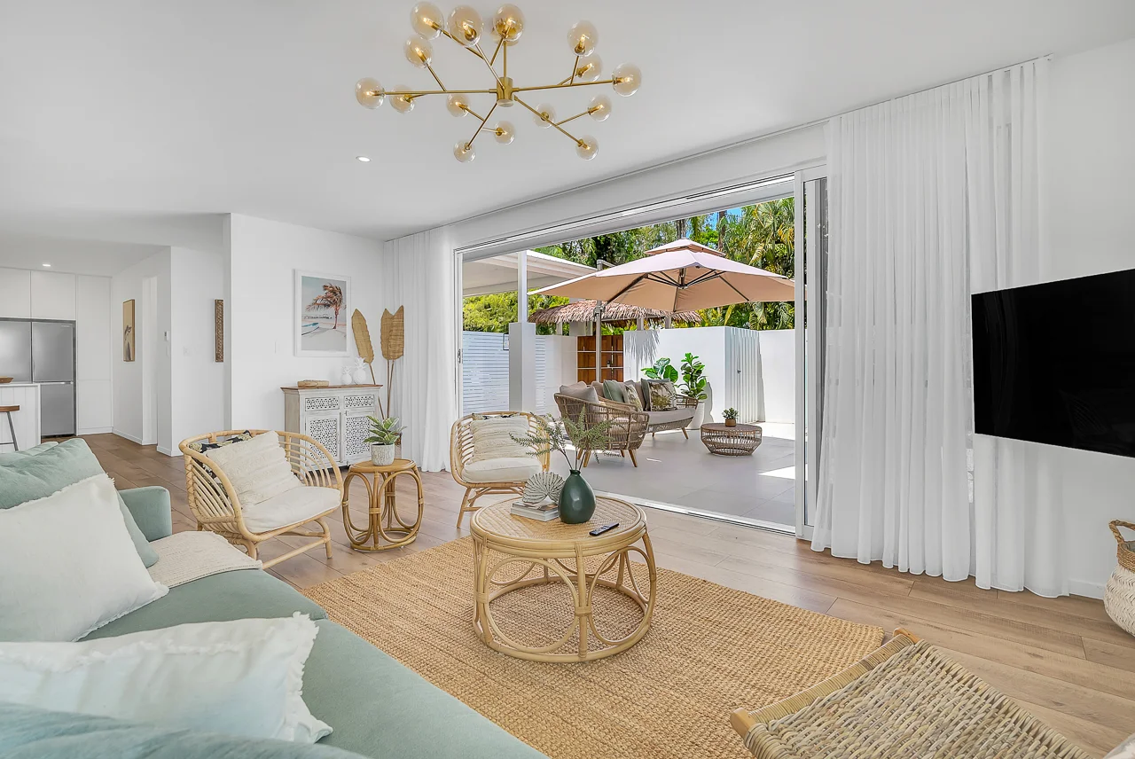 Bright and balanced living area with clear window views and natural lighting after US real estate HDR processing.