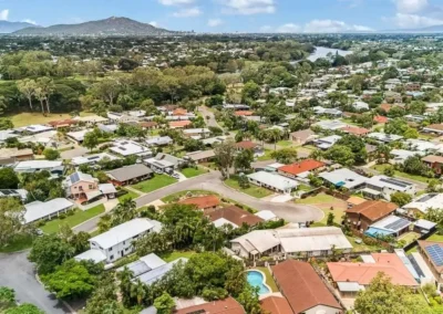 High-quality real estate drone aerial editing featuring bright skies and enhanced property details.