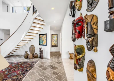 Modern entryway and staircase with professional color balancing and architectural detail enhancement.